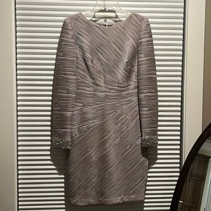 Stunning silver cocktail dress with beaded cuffs.